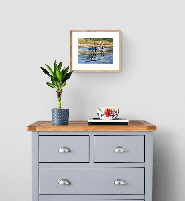 Low tide woolacombe beach print hanging above a wooden chest of drawers