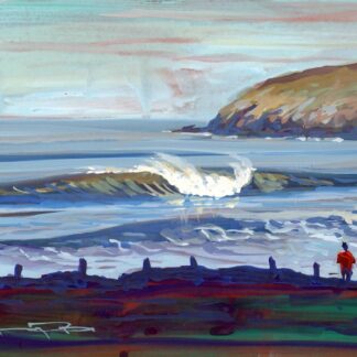 Surfer watching the waves at Croyde beach Devon