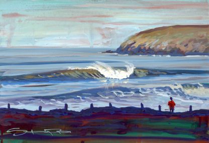 Surfer watching the waves at Croyde beach Devon