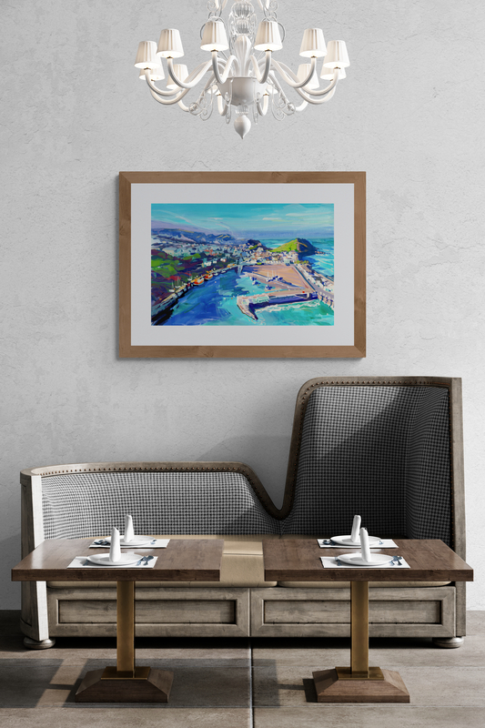 Winter Light Ilfracombe Harbour in a wooden frame hanging in a dining room