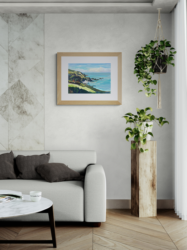 Lee Bay Low Tide art print in a wooden frame hanging in a nature themed living room
