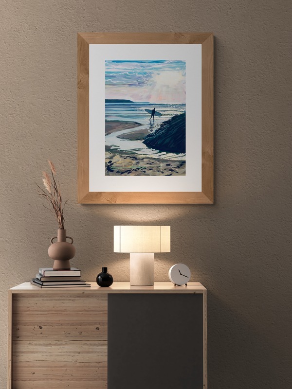 Sunset Surf surfer Woolacombe print hanging in a lamp lit room. Original painting by Steve PP Fine Art