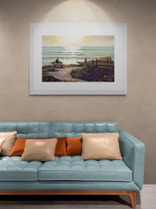 Gazing out print hanging on a wall above a blue leather sofa
