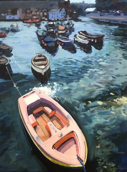 pink dinghy at mevagissey harbour Cornwall UK