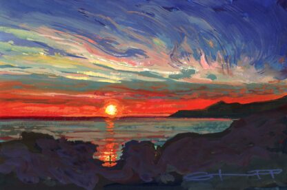 Red and orange sunset over the sea reflecting onto a figure standing on the shore