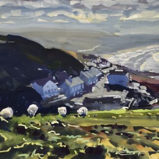 sheep grazing on Morte point Devon with Woolacombe beach in the distance