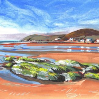 blue skies sandy Croyde beach with rocks exposed at low tide, with Baggy Point headland in the distance