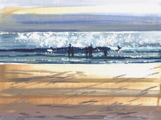 bellyboard surfers sliding across a sparkling wave on Woolacombe beach on a hot summer day