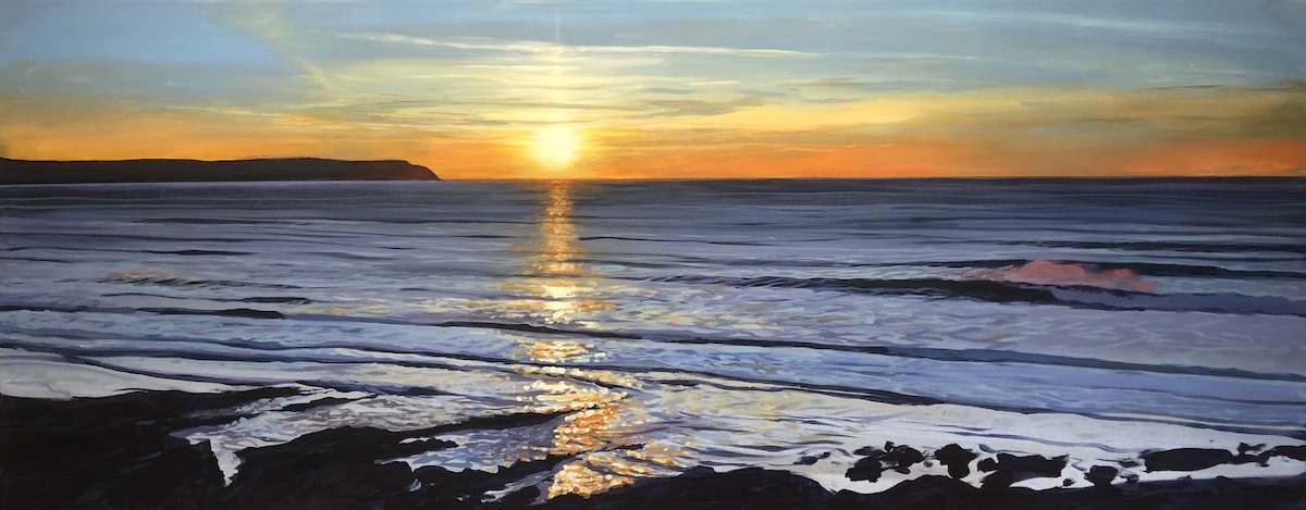 golden sunset seascape with waves breaking on Woolacombe beach