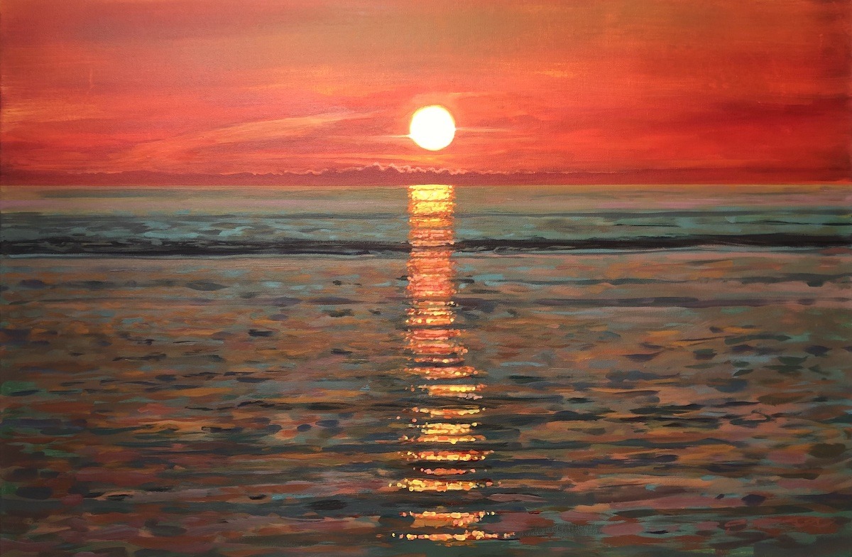 warm sunset sparkling reflections over a calm sea