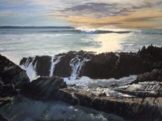Waves breaking over rocks at Woolacombe beach