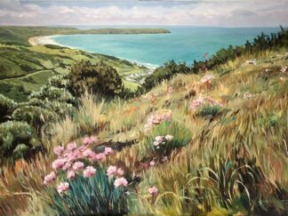 Coastal landscape with sea pinks and foxgloves in the foreground