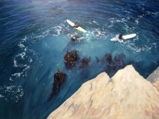 two surfers sitting on their surfboards in the ocean