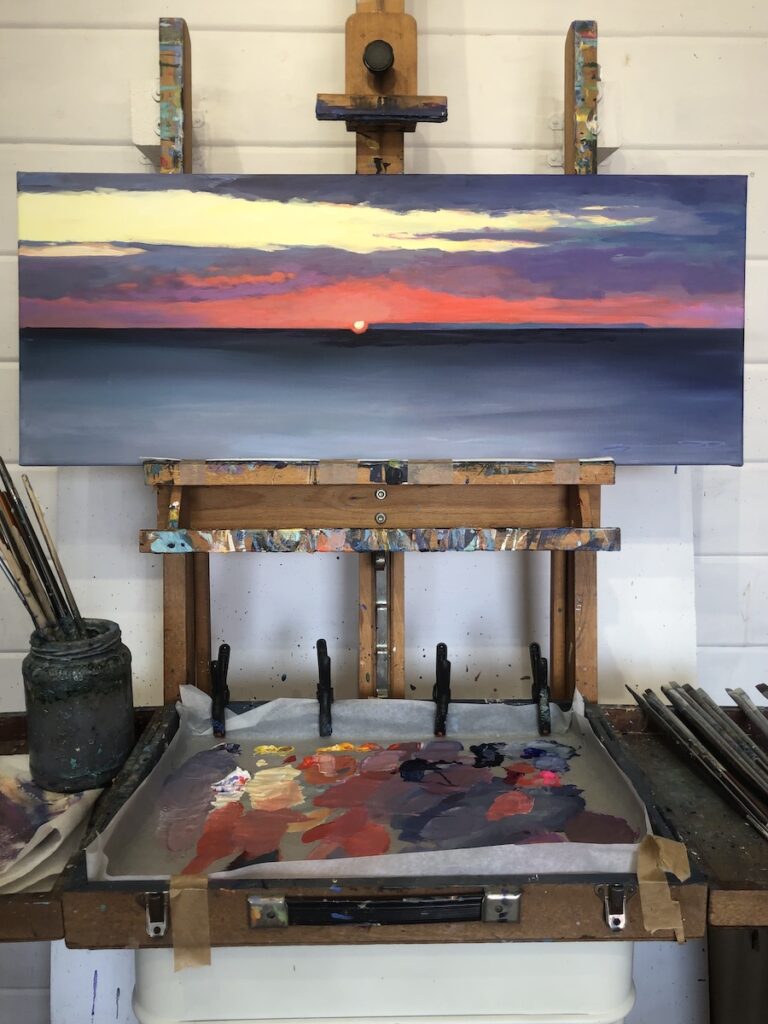 Original Lundy sunset painting on an easel by Woolacombe artist Steven Pleydell-Pearce